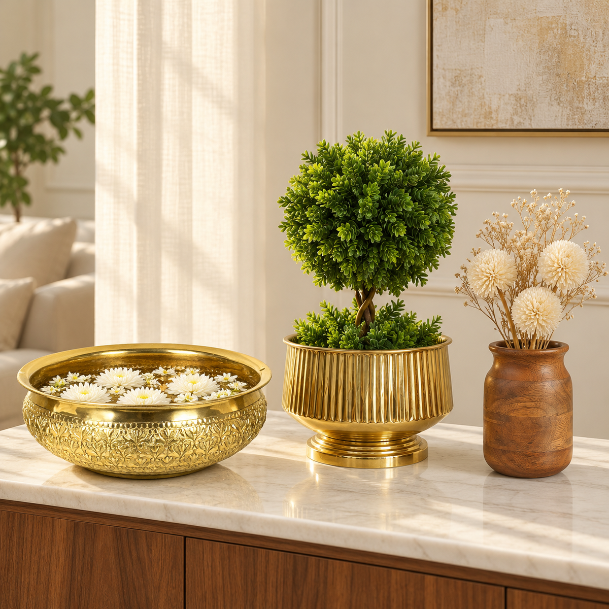 Gold urli and pedestal planter styled with a walnut wood vase