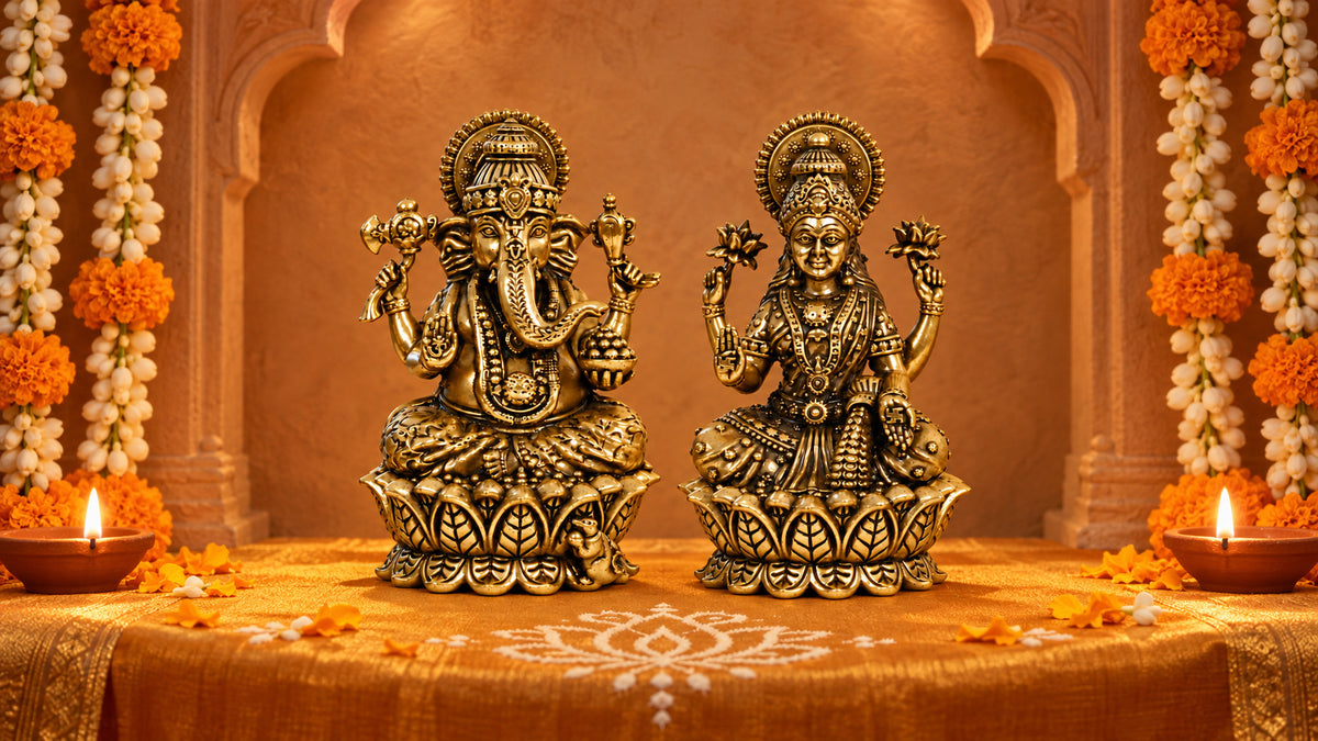 Brass Lakshmi and Ganesha idols on lotus bases in a marigold-decorated mandir with clay diyas