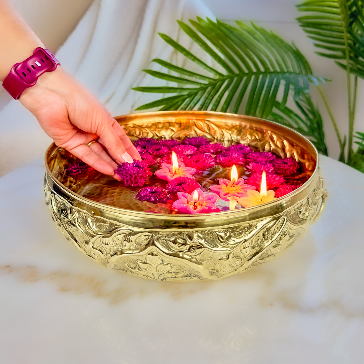 Product image of a Brass Gulmohar Urli from Indian Impressions, featuring a beautifully crafted design with intricate floral detailing. The urli has a polished brass finish, ideal for adding a touch of elegance to home décor, spiritual rituals, or gifting, and is perfect for enhancing the ambiance of any space.