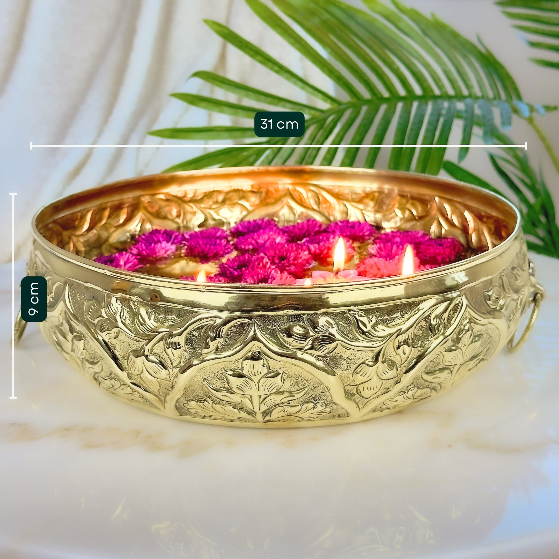 Product image of a Brass Gulmohar Urli from Indian Impressions, featuring a beautifully crafted design with intricate floral detailing. The urli has a polished brass finish, ideal for adding a touch of elegance to home décor, spiritual rituals, or gifting, and is perfect for enhancing the ambiance of any space.