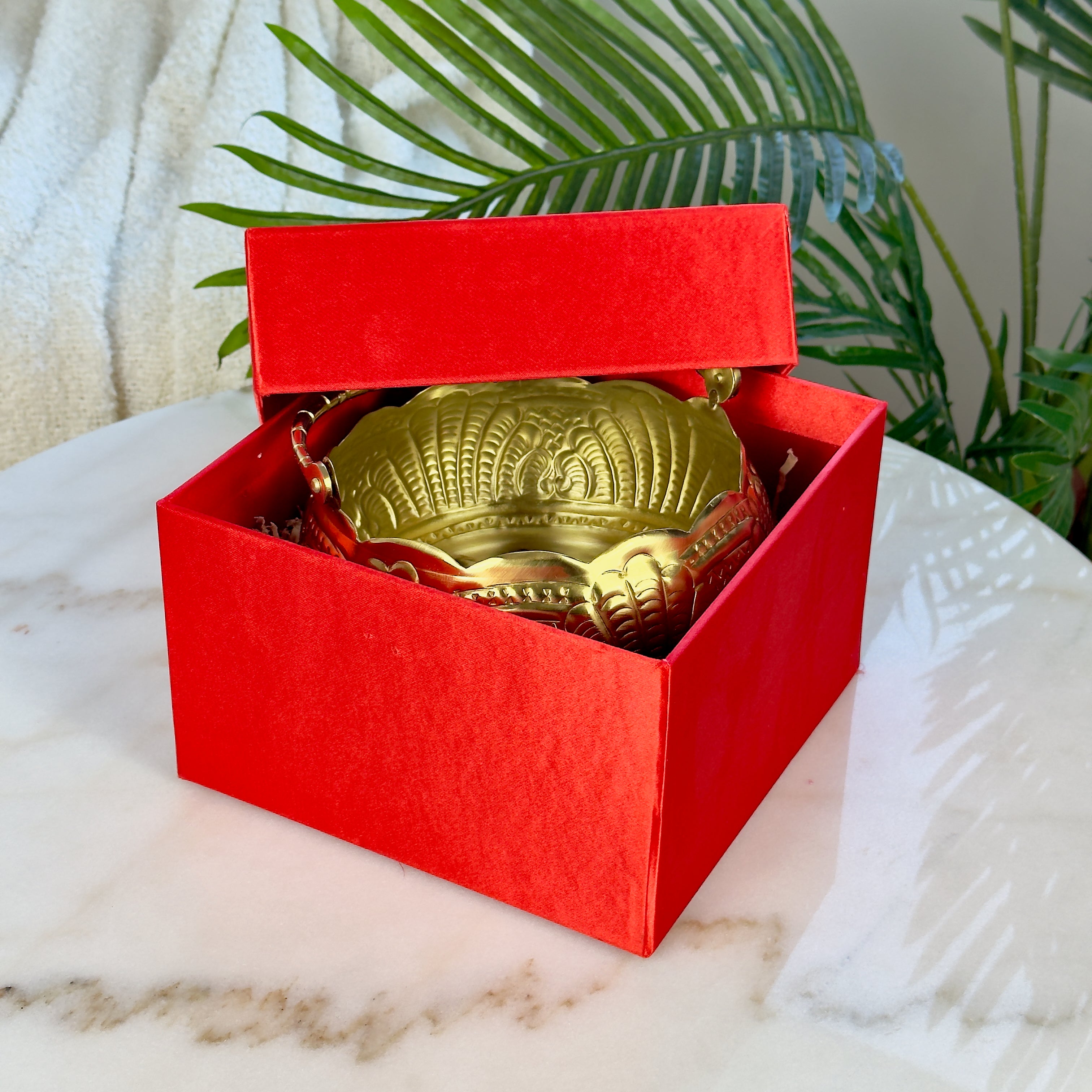Product image of a Puspam Brass Flower Basket from Indian Impressions, featuring an intricately handcrafted design with traditional motifs. Made from polished brass, this elegant basket is perfect for holding flowers, enhancing Vastu energy, festive décor, or gifting, adding a touch of charm and positivity to any space.