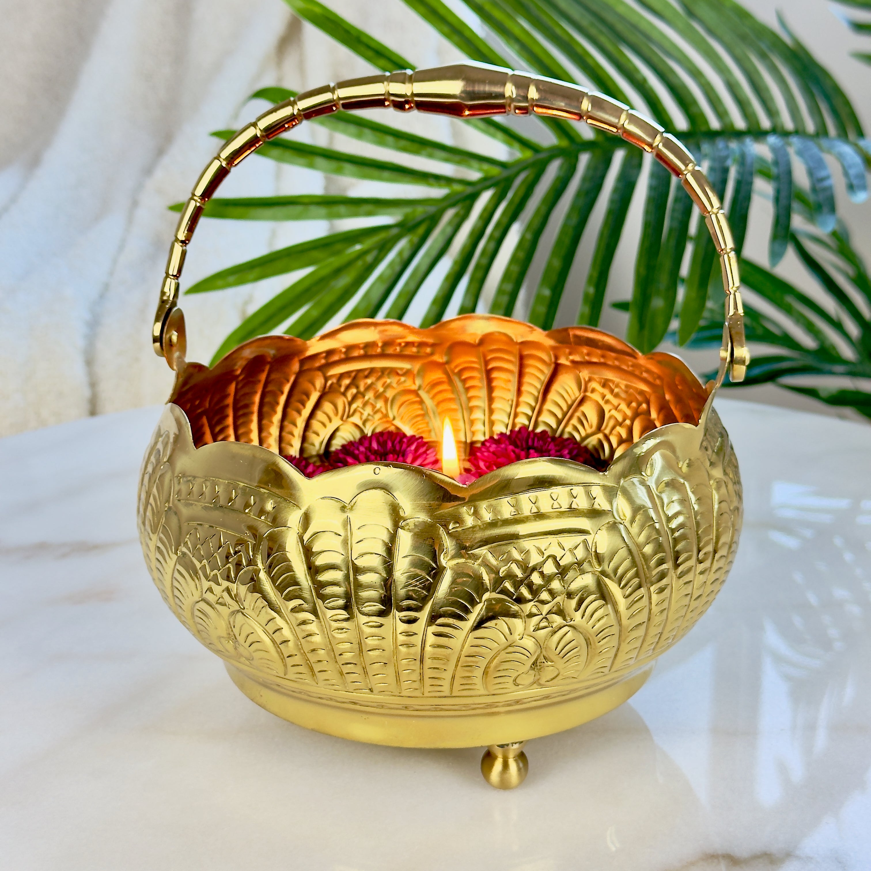 Product image of a Puspam Brass Flower Basket from Indian Impressions, featuring an intricately handcrafted design with traditional motifs. Made from polished brass, this elegant basket is perfect for holding flowers, enhancing Vastu energy, festive décor, or gifting, adding a touch of charm and positivity to any space.