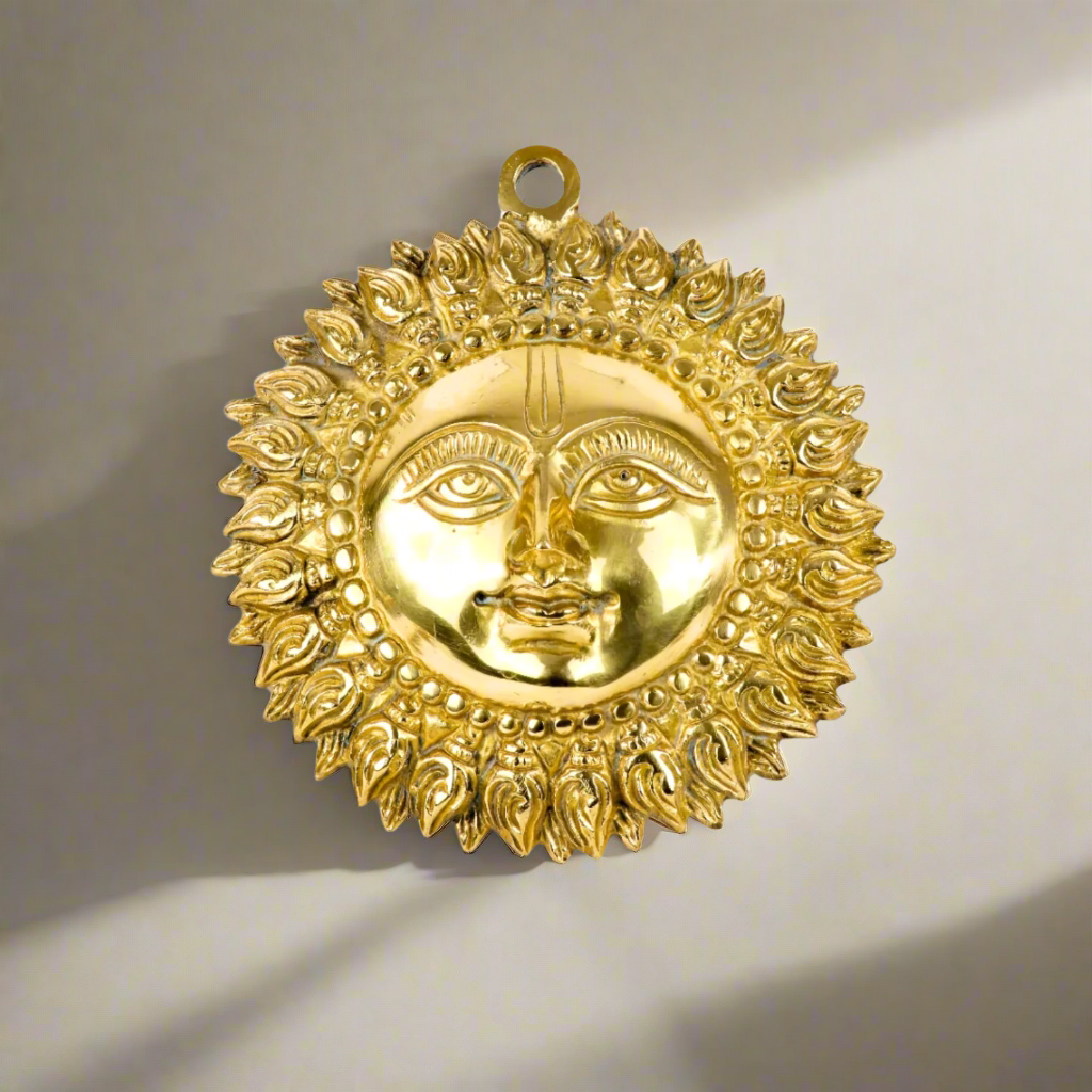 Product image of a Brass Sun Idol from Indian Impressions, featuring a radiant design with intricate detailing symbolizing energy and vitality. Crafted from polished brass, this idol is ideal for Vastu, spiritual practices, home décor, or gifting, bringing positivity and warmth to any space.