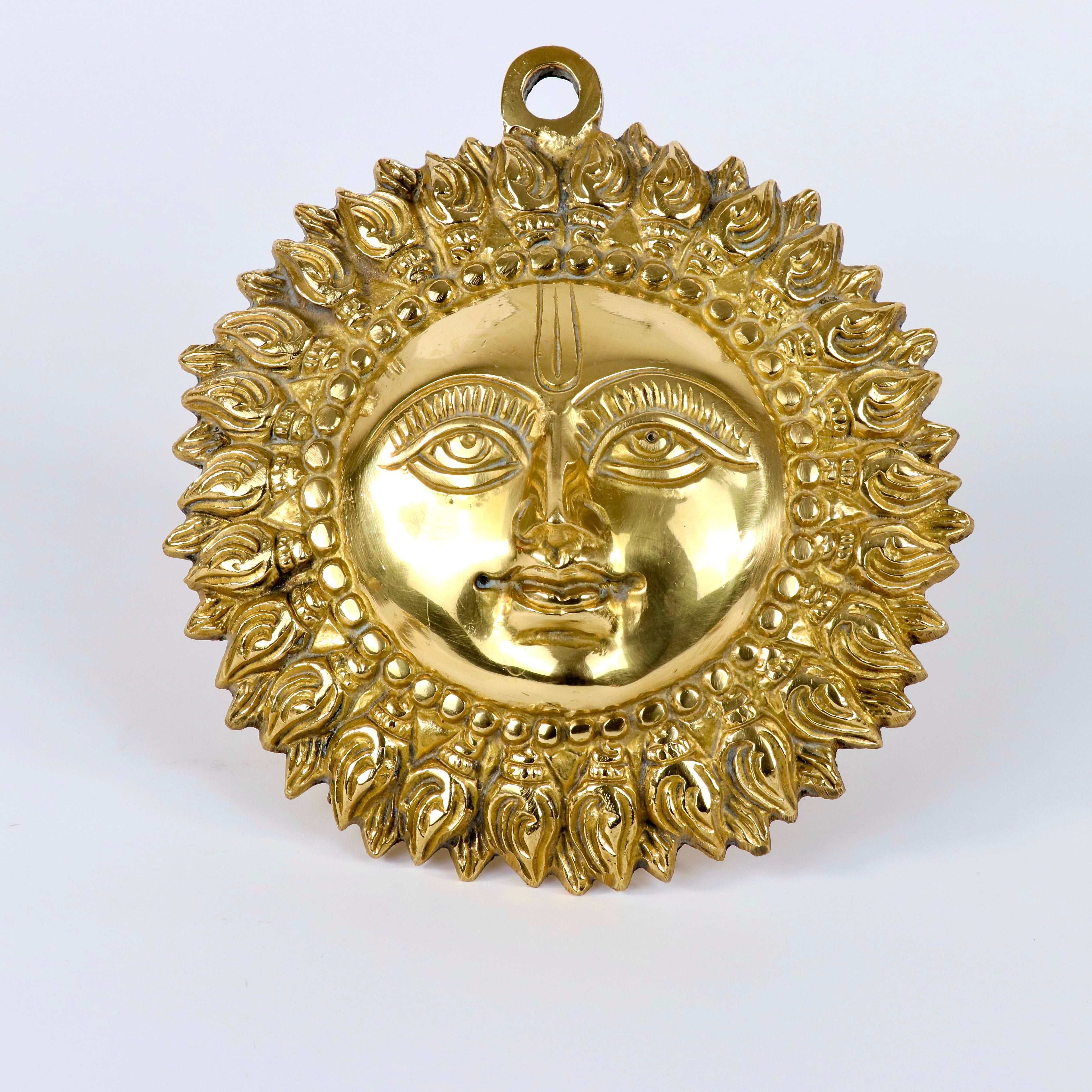 Product image of a Brass Sun Idol from Indian Impressions, featuring a radiant design with intricate detailing symbolizing energy and vitality. Crafted from polished brass, this idol is ideal for Vastu, spiritual practices, home décor, or gifting, bringing positivity and warmth to any space.