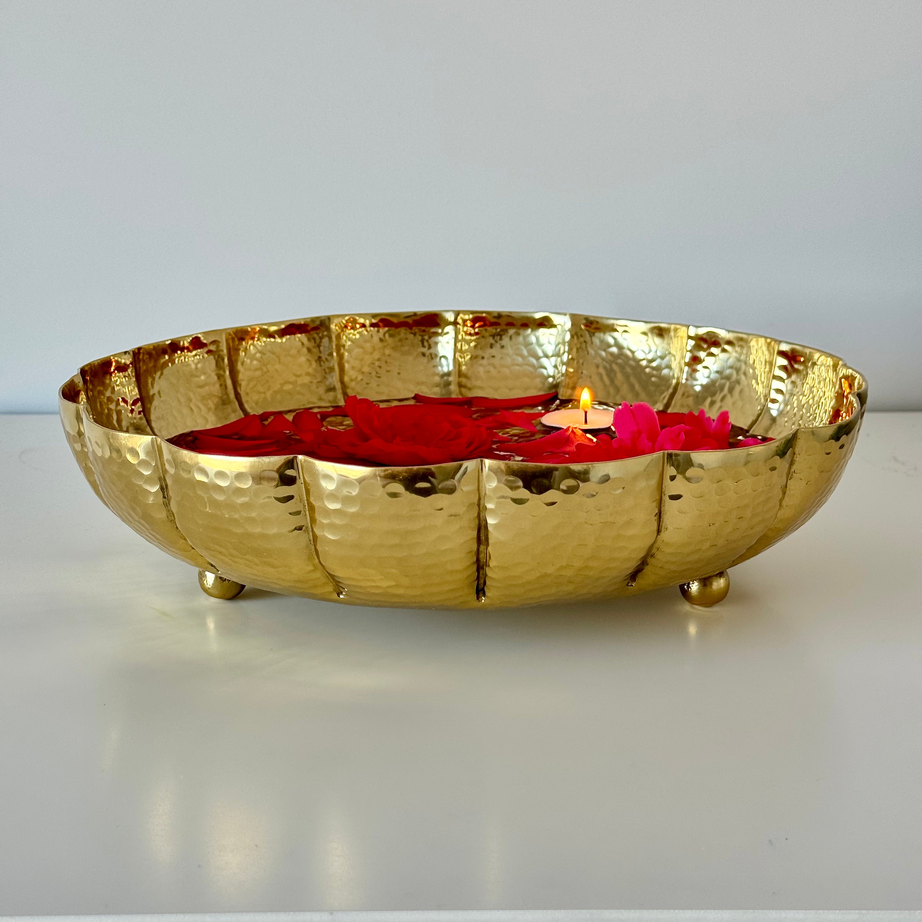 Product image of the Juhi Urli from Indian Impressions, featuring a sleek, handcrafted design with a polished gold-colored finish. Made from aluminum, this lightweight urli is perfect for Vastu, home décor, festive decorations, or gifting, adding a touch of elegance and positivity to any space.