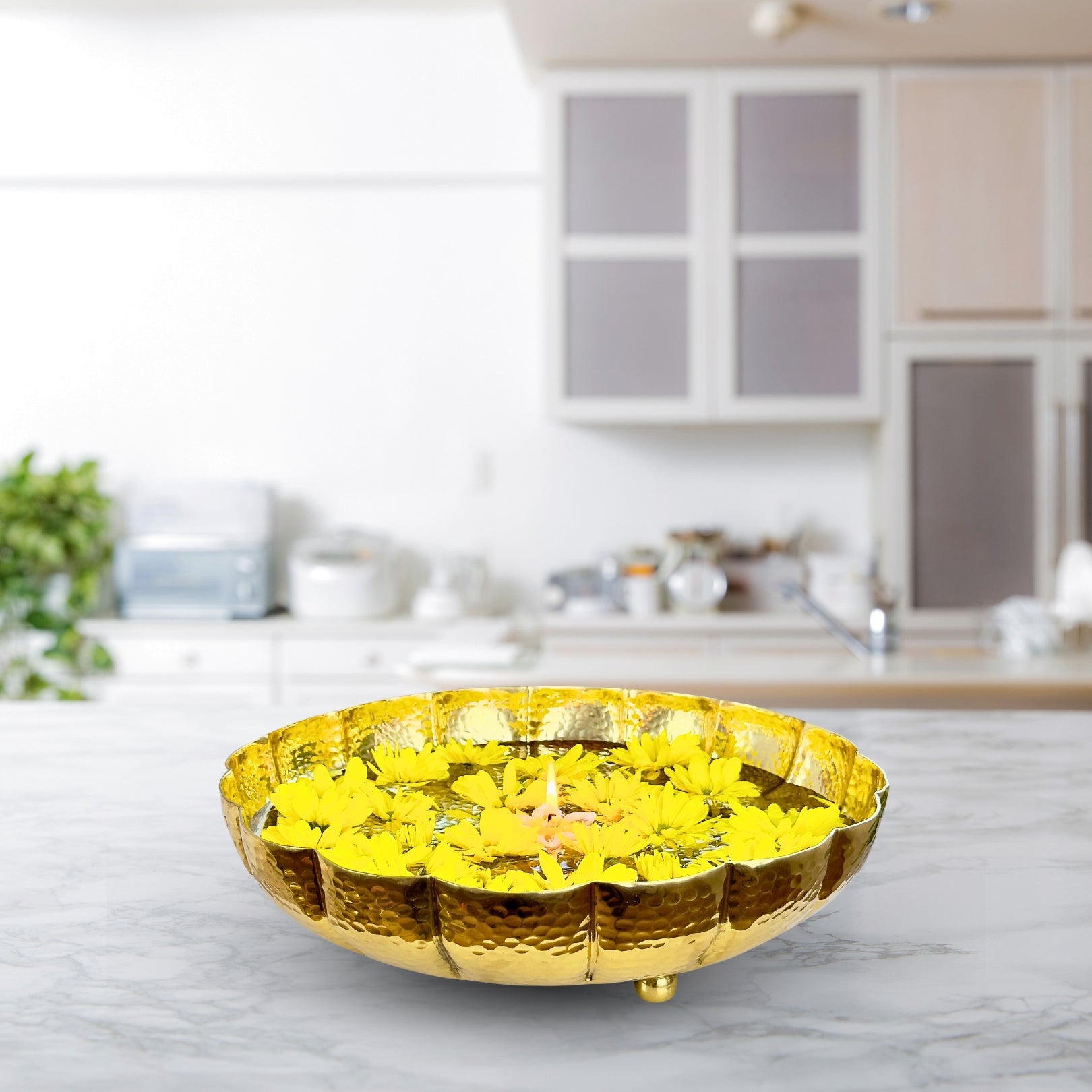 Product image of the Juhi Urli from Indian Impressions, featuring a sleek, handcrafted design with a polished gold-colored finish. Made from aluminum, this lightweight urli is perfect for Vastu, home décor, festive decorations, or gifting, adding a touch of elegance and positivity to any space.