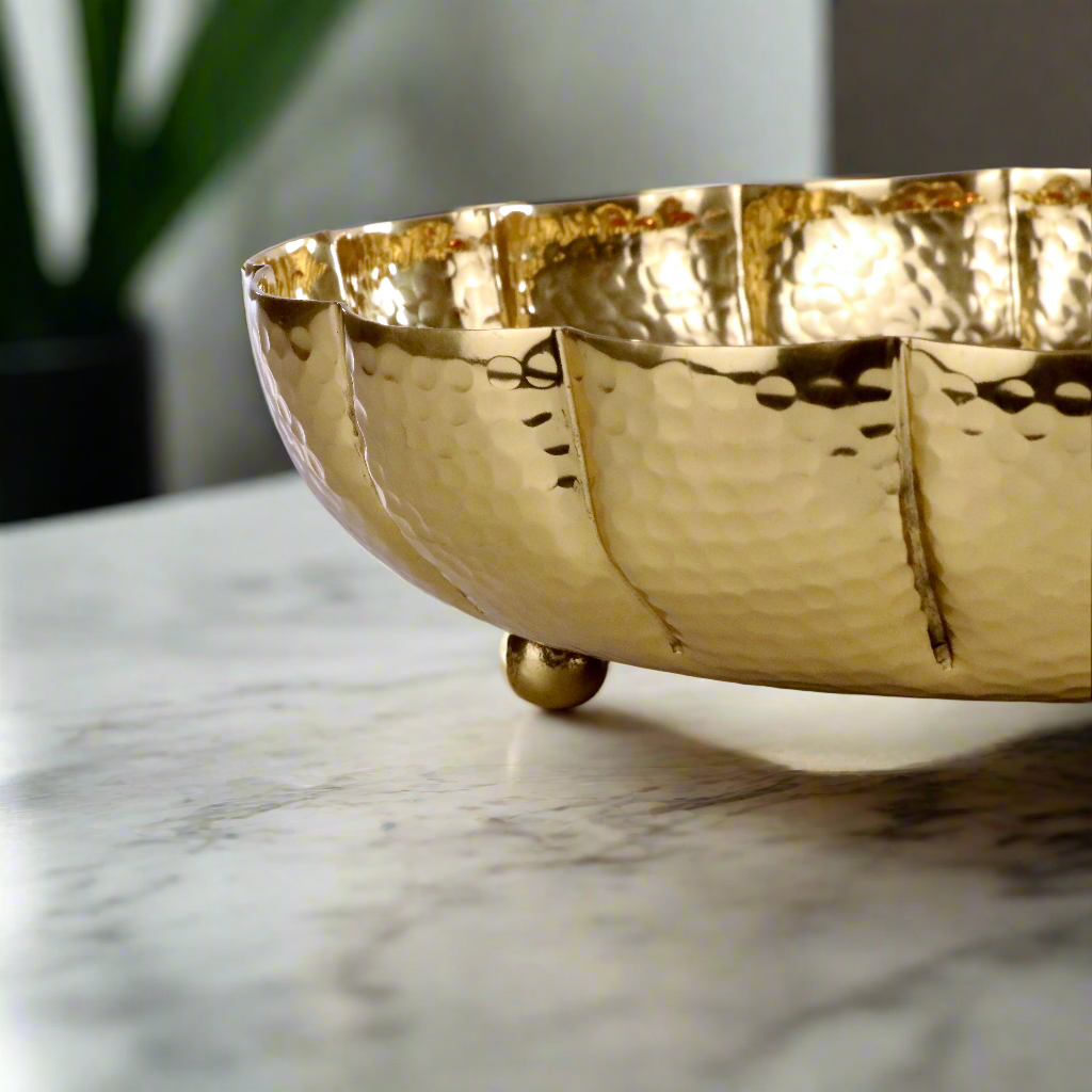 Product image of the Juhi Urli from Indian Impressions, featuring a sleek, handcrafted design with a polished gold-colored finish. Made from aluminum, this lightweight urli is perfect for Vastu, home décor, festive decorations, or gifting, adding a touch of elegance and positivity to any space.