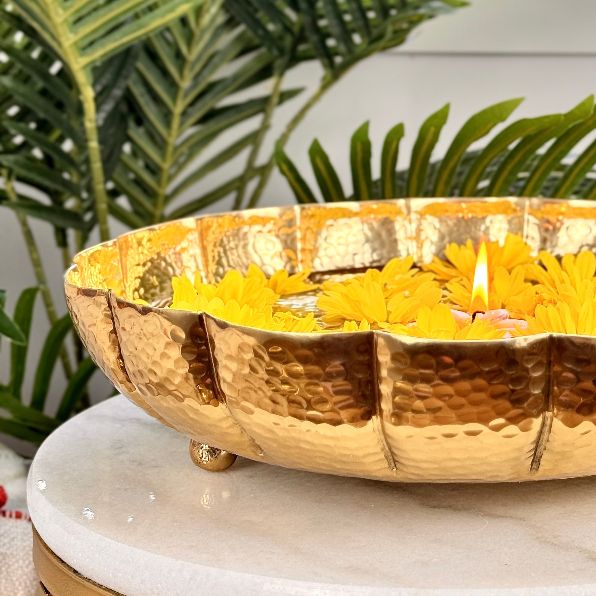 Product image of the Juhi Urli from Indian Impressions, featuring a sleek, handcrafted design with a polished gold-colored finish. Made from aluminum, this lightweight urli is perfect for Vastu, home décor, festive decorations, or gifting, adding a touch of elegance and positivity to any space.