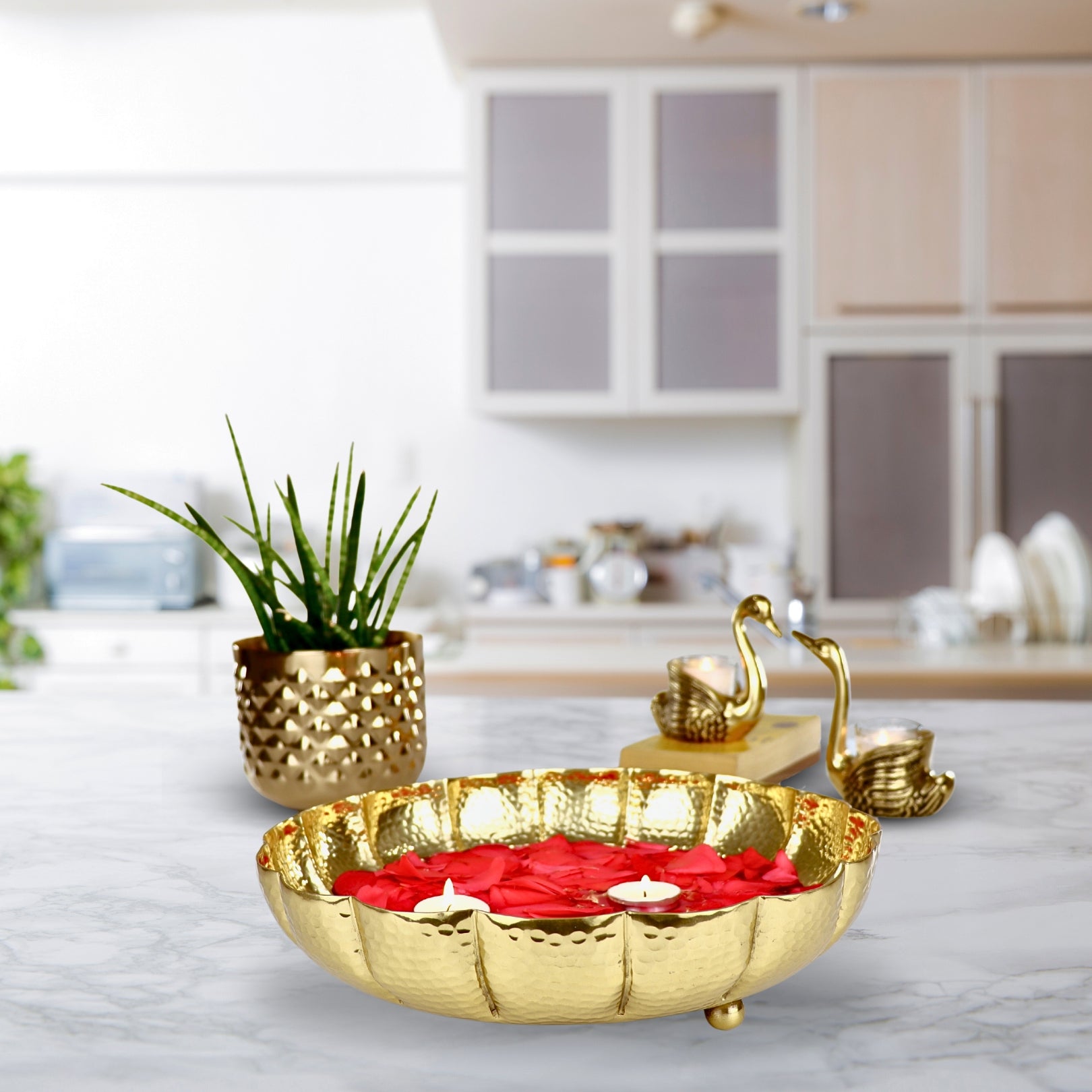 Product image of the Juhi Urli from Indian Impressions, featuring a sleek, handcrafted design with a polished gold-colored finish. Made from aluminum, this lightweight urli is perfect for Vastu, home décor, festive decorations, or gifting, adding a touch of elegance and positivity to any space.