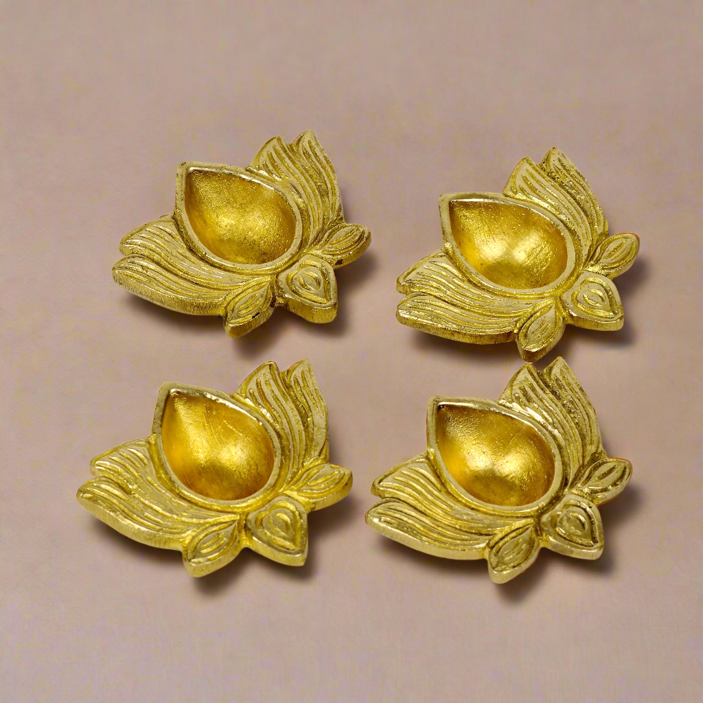Product image of a Brass Lotus Diya from Indian Impressions, featuring an elegant lotus-shaped design with intricate detailing. The diya is crafted from polished brass, making it ideal for holding oil or ghee for spiritual rituals, enhancing the ambiance of any space. Perfect for Vastu, home décor, or gifting, it symbolizes purity and divine light.