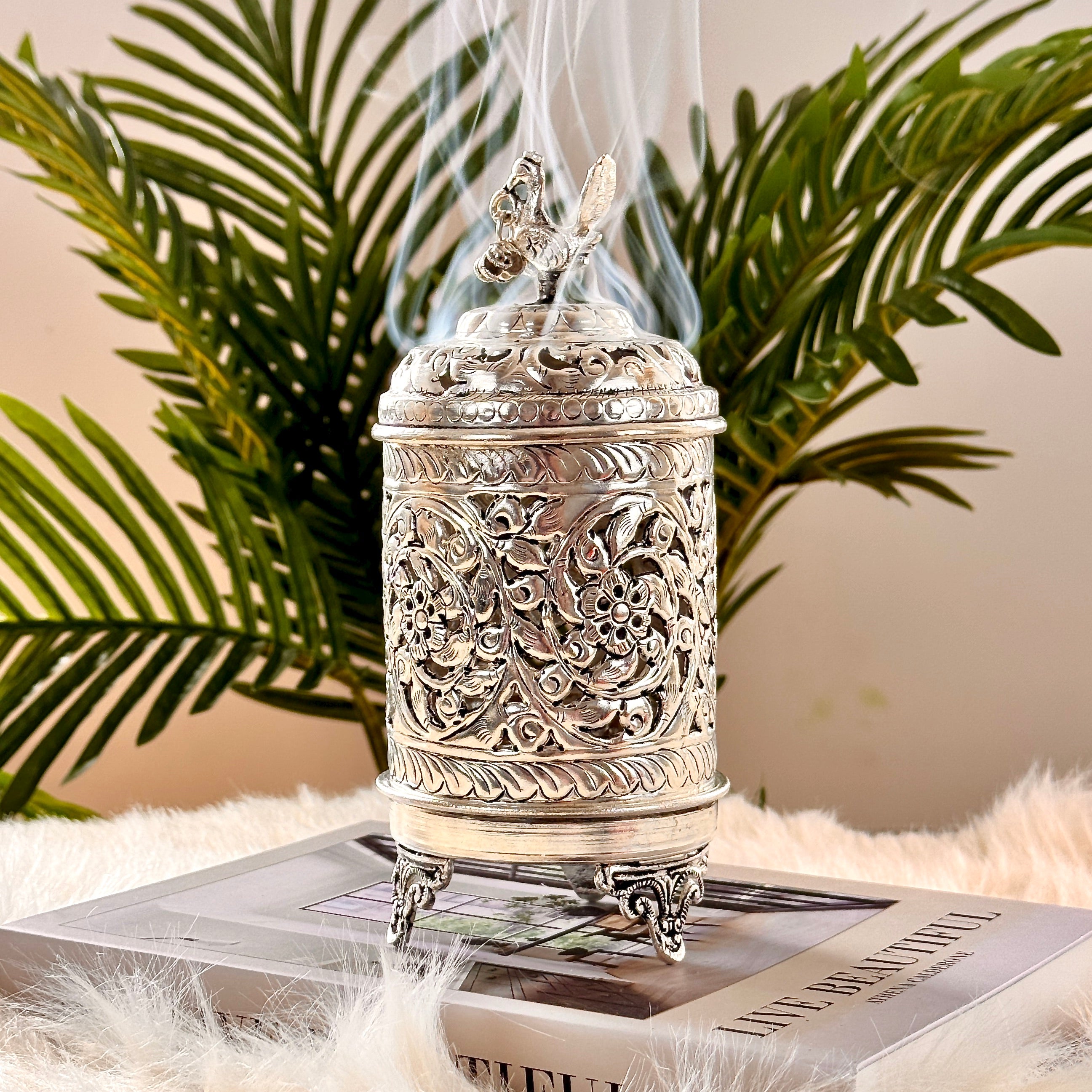 Product image of the Mayur Jyoti Dhuna in German Silver from Indian Impressions, featuring an intricately designed peacock-shaped incense burner that can also be used as a diya. Ideal for Vastu, spiritual rituals, and home décor, bringing positivity, elegance, and a divine ambiance to any space.