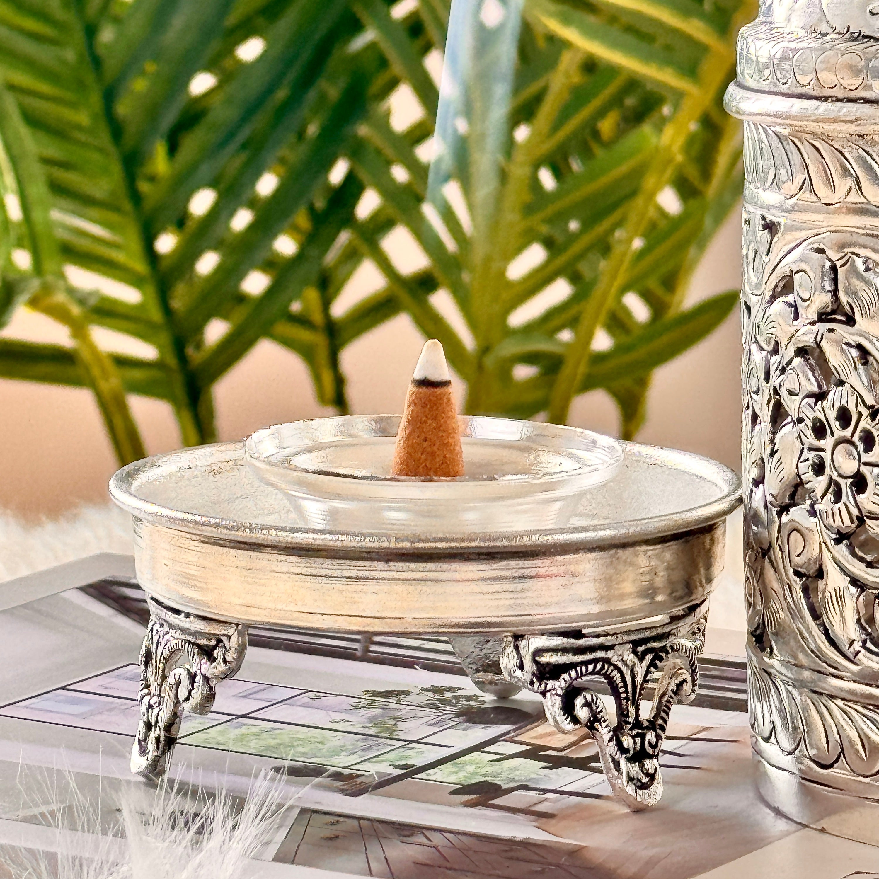 Product image of the Mayur Jyoti Dhuna in German Silver from Indian Impressions, featuring an intricately designed peacock-shaped incense burner that can also be used as a diya. Ideal for Vastu, spiritual rituals, and home décor, bringing positivity, elegance, and a divine ambiance to any space.
