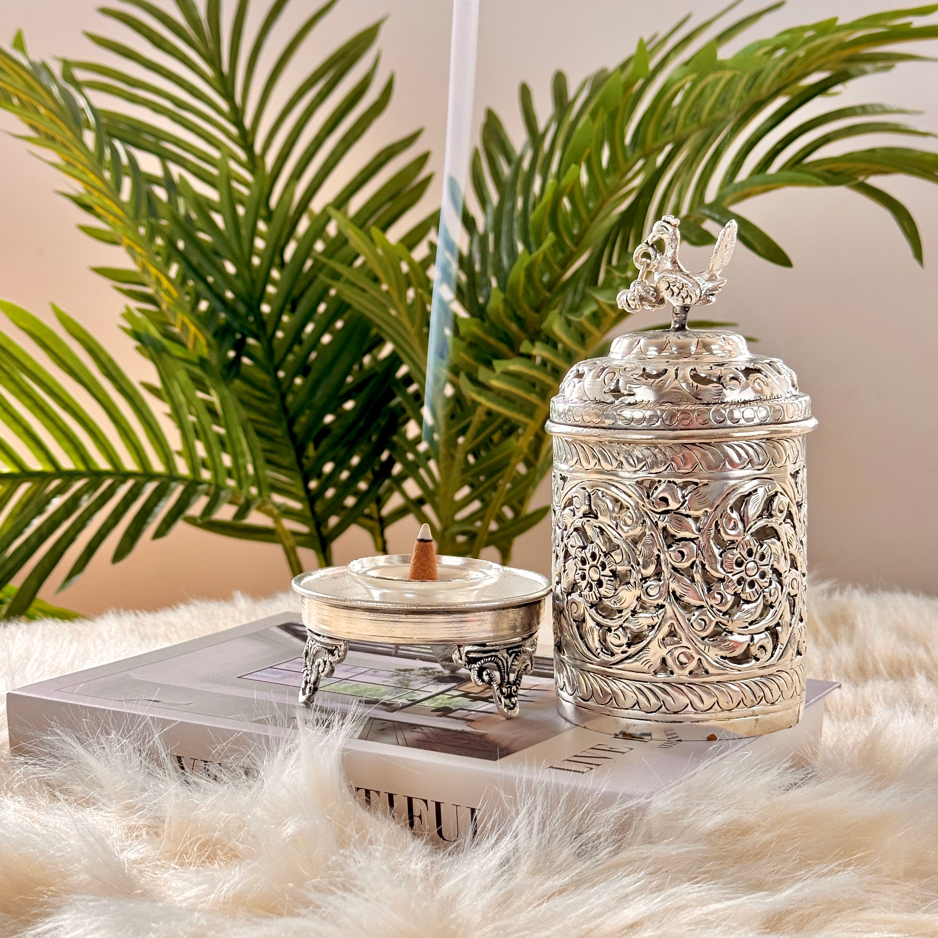 Product image of the Mayur Jyoti Dhuna in German Silver from Indian Impressions, featuring an intricately designed peacock-shaped incense burner that can also be used as a diya. Ideal for Vastu, spiritual rituals, and home décor, bringing positivity, elegance, and a divine ambiance to any space.