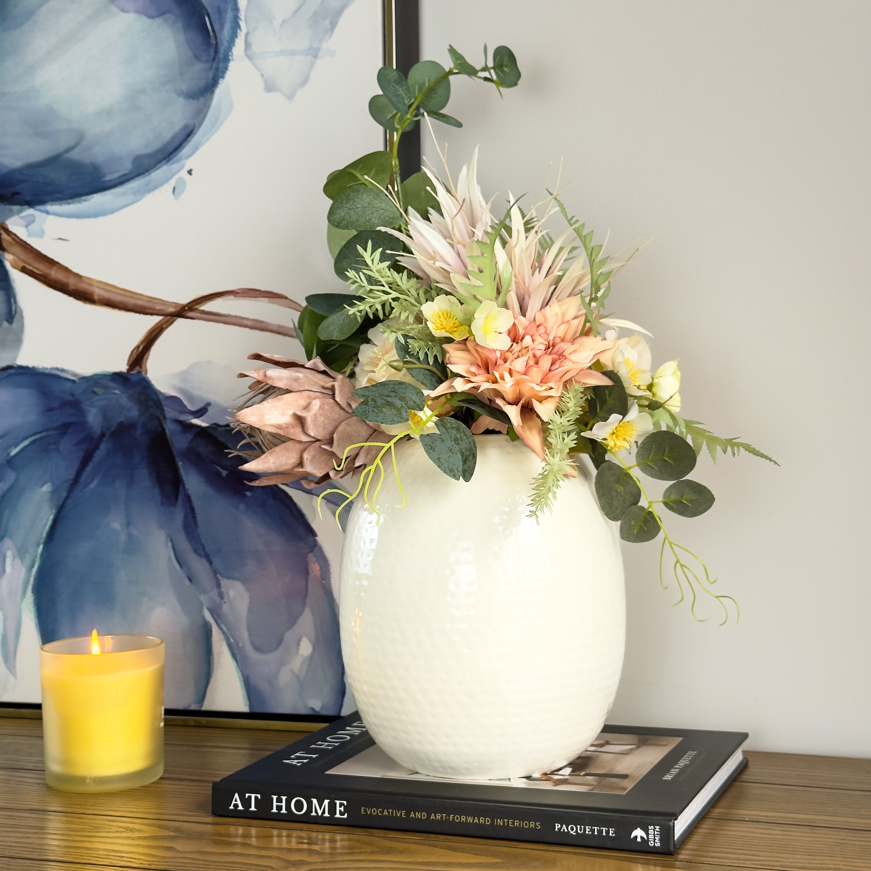 Product image of the Oval Vase Hammered White from Indian Impressions, featuring a sleek oval shape with a textured hammered finish. Designed with a polished white tone, this vase is ideal for displaying flowers or as a standalone décor piece. Perfect for Vastu, home décor, or gifting, bringing a modern and elegant touch to any space.