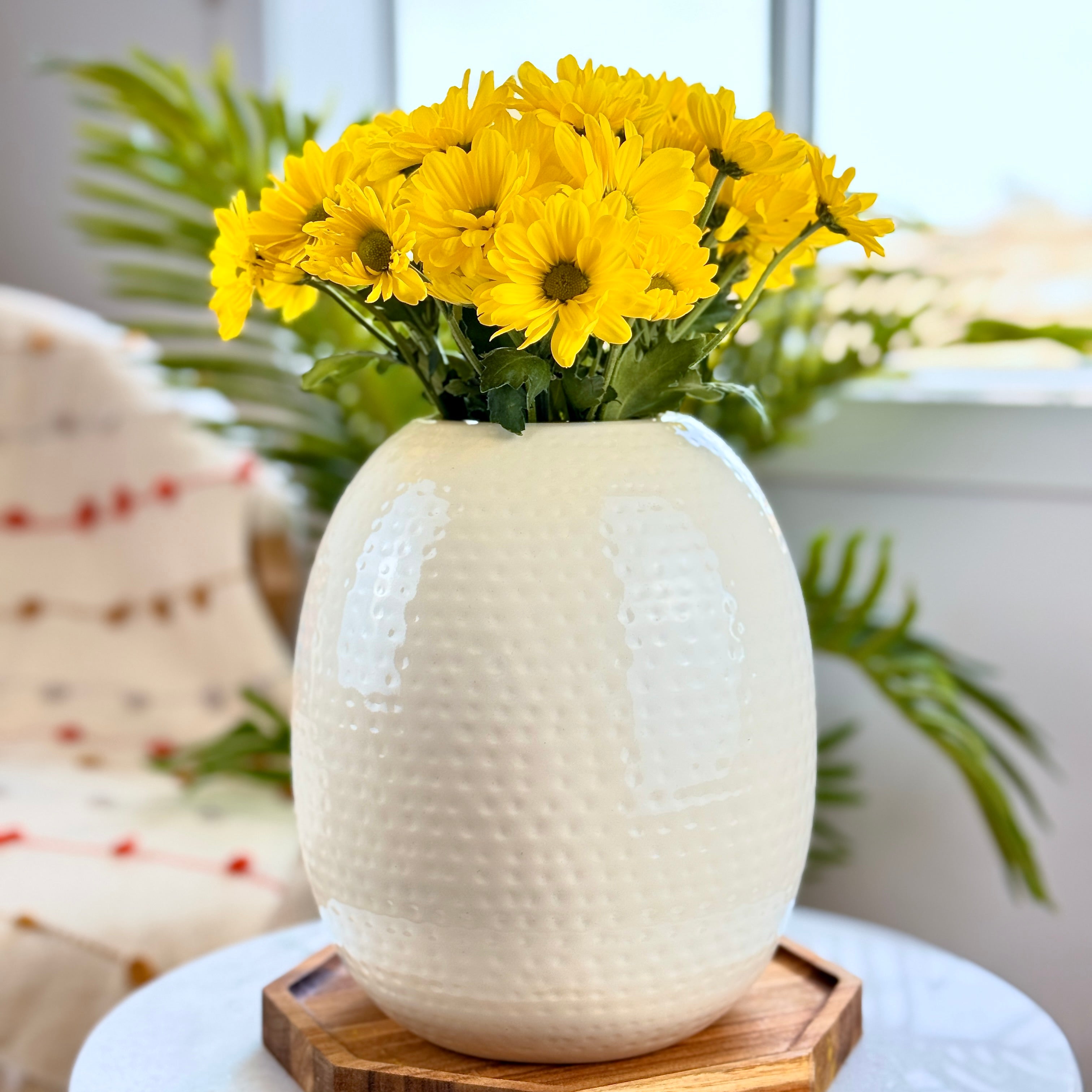 Product image of the Oval Vase Hammered White from Indian Impressions, featuring a sleek oval shape with a textured hammered finish. Designed with a polished white tone, this vase is ideal for displaying flowers or as a standalone décor piece. Perfect for Vastu, home décor, or gifting, bringing a modern and elegant touch to any space.