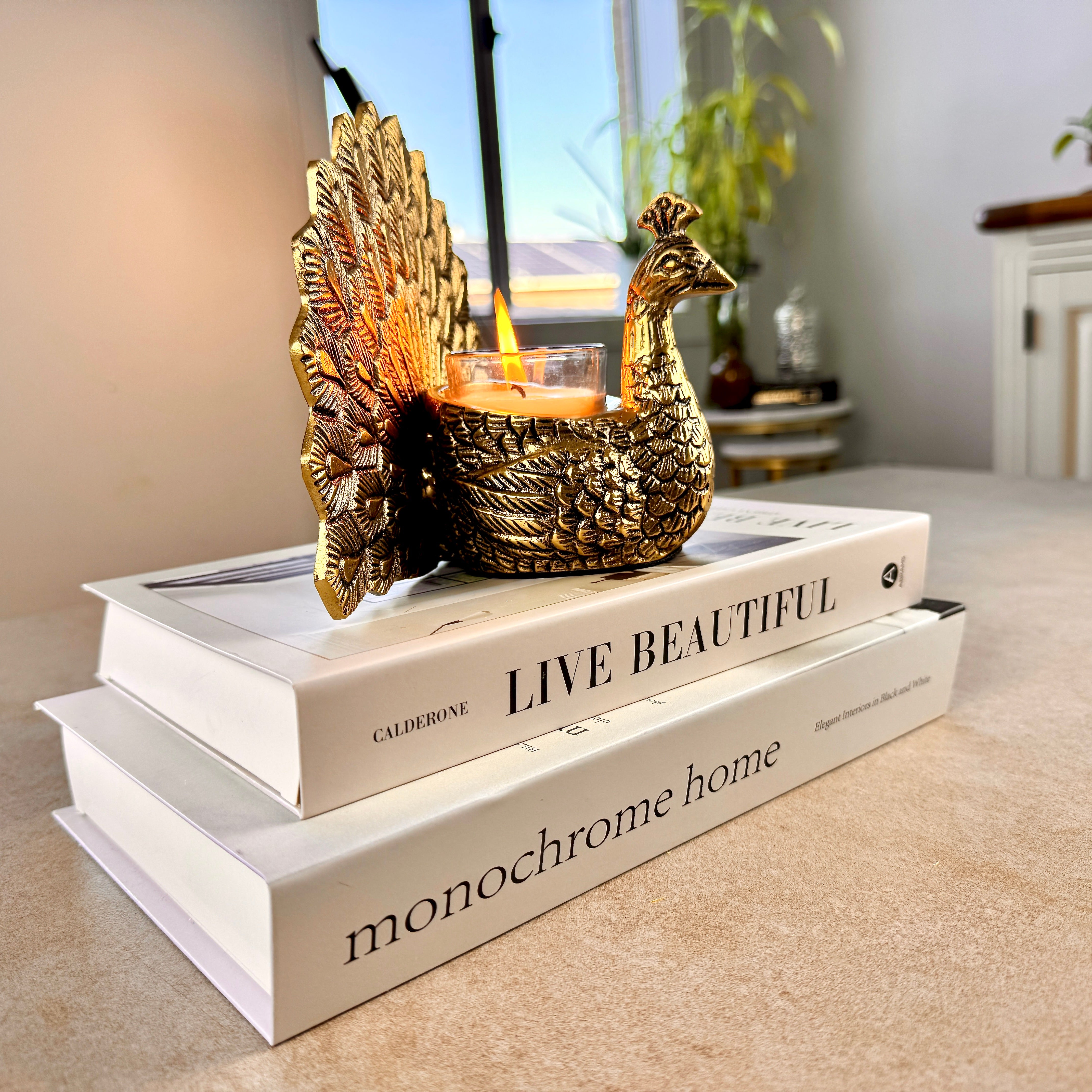 Product image of the Peacock Candle Holder with Antique Brass Finish from Indian Impressions, showcasing a stunning peacock design with intricate detailing and a vintage-inspired finish. Ideal for holding candles, this piece is perfect for Vastu, home décor, festive occasions, or gifting, adding elegance and positive energy to any space.