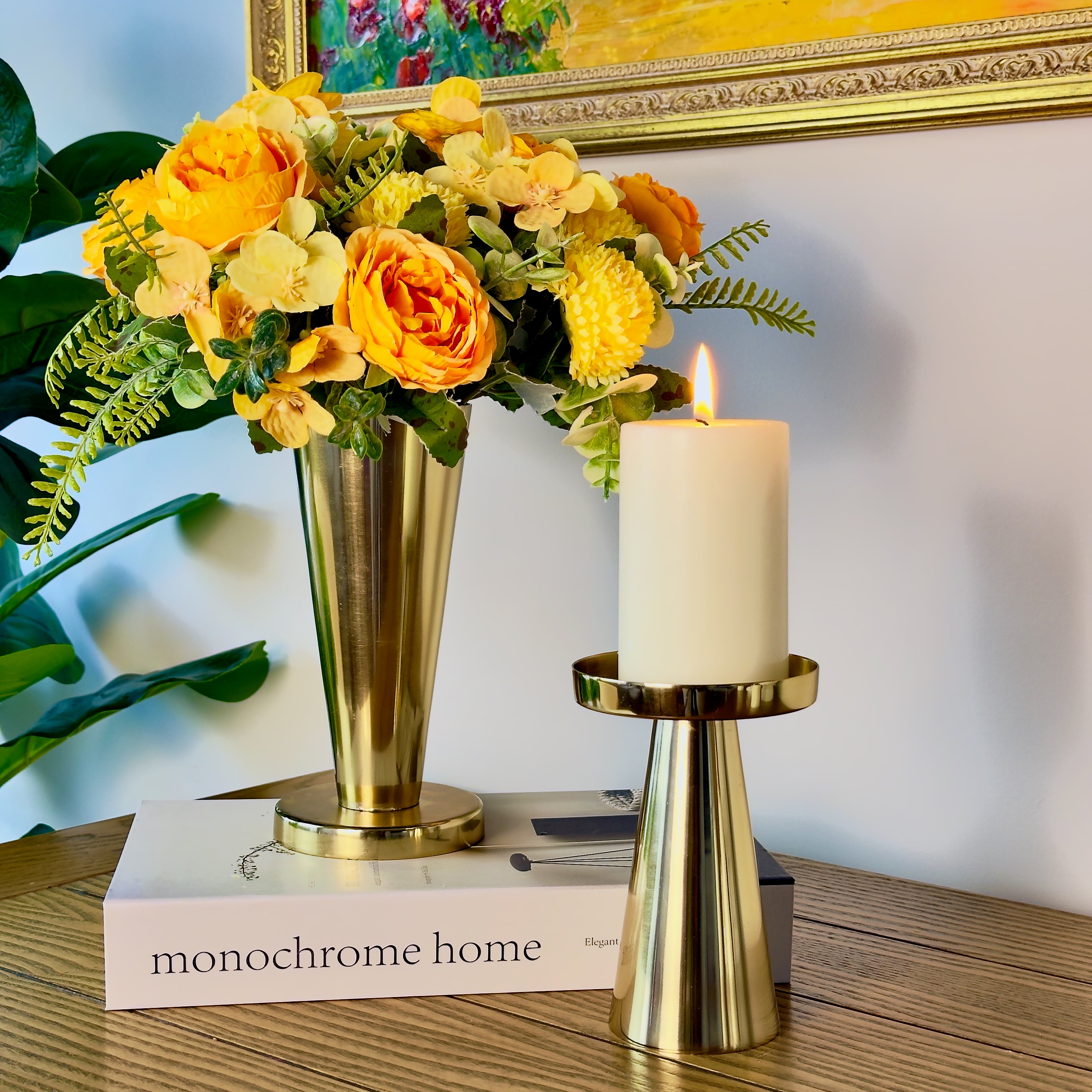 Product image of a Metal Candle Holder Set of 2 from Indian Impressions, featuring elegantly crafted holders with a Polished finish. Designed for pillar or taper candles, these holders add a touch of sophistication to any setting. Perfect for Vastu, home décor, festive occasions, or gifting.