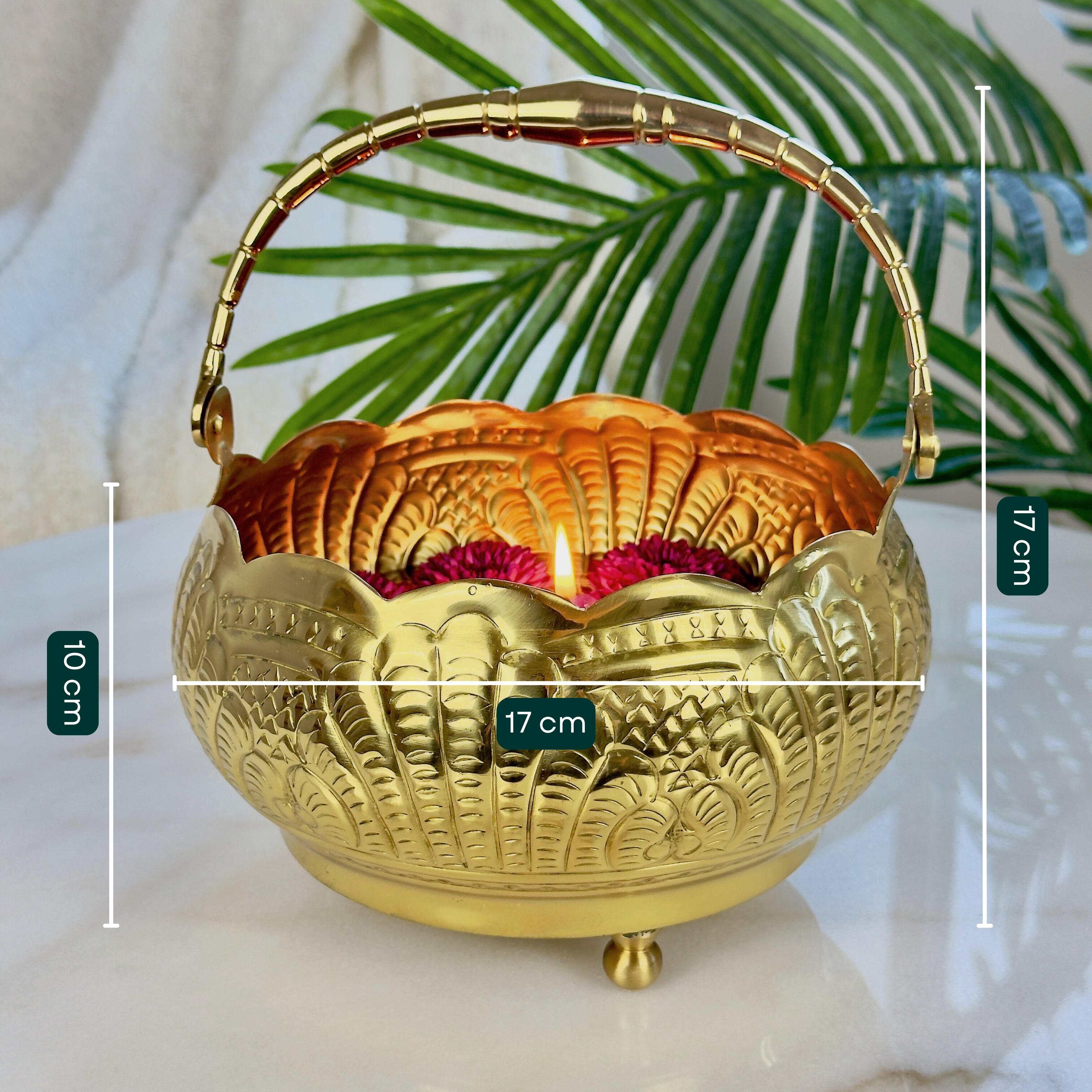 Product image of a Puspam Brass Flower Basket from Indian Impressions, featuring an intricately handcrafted design with traditional motifs. Made from polished brass, this elegant basket is perfect for holding flowers, enhancing Vastu energy, festive décor, or gifting, adding a touch of charm and positivity to any space.
