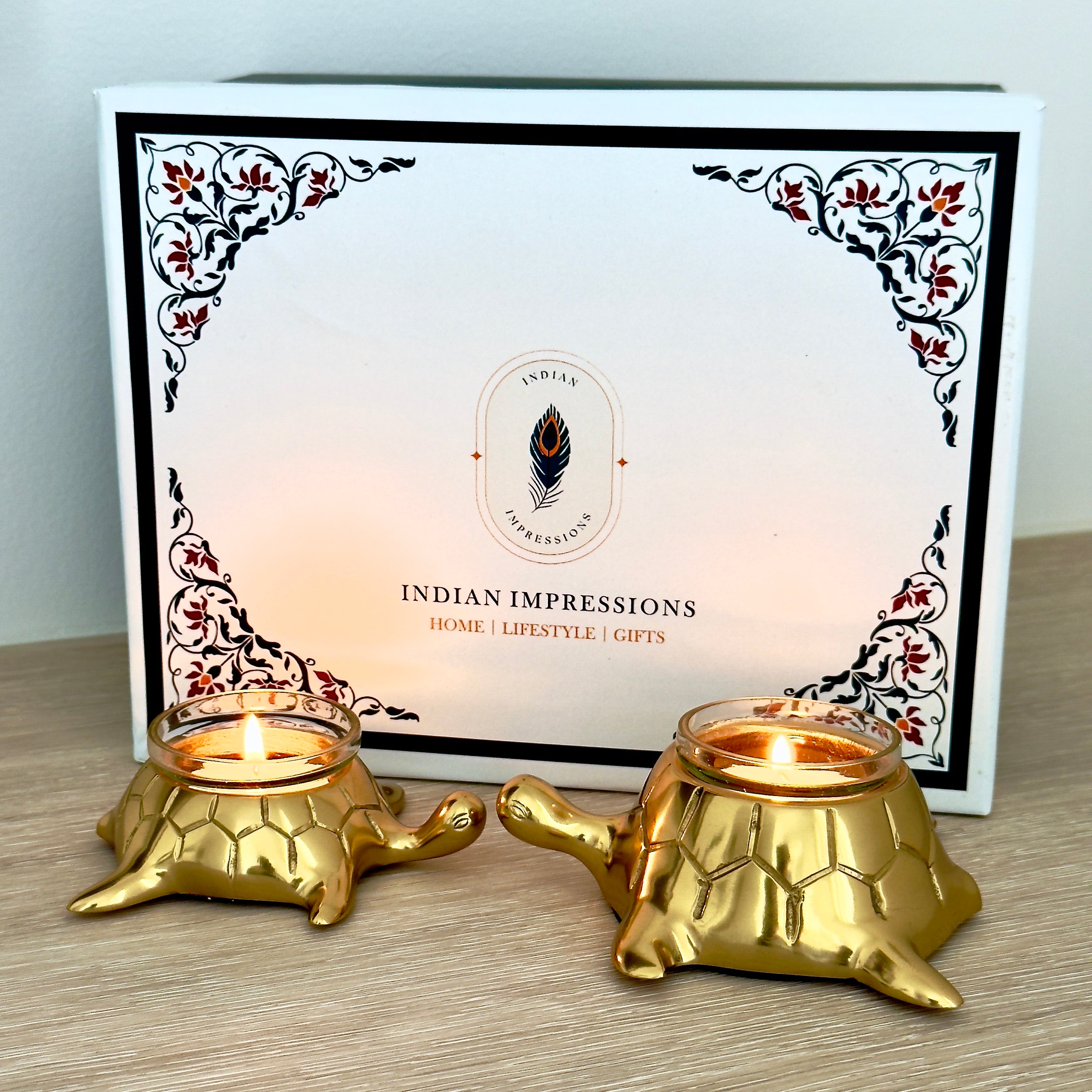 Product image of the Turtle Candle Holder Pair in Gold from Indian Impressions, featuring two beautifully crafted turtle-shaped candle holders with a polished gold finish. Ideal for holding candles, this pair symbolizes stability and longevity. Perfect for Vastu, home décor, or gifting, adding elegance and positive energy to any space.