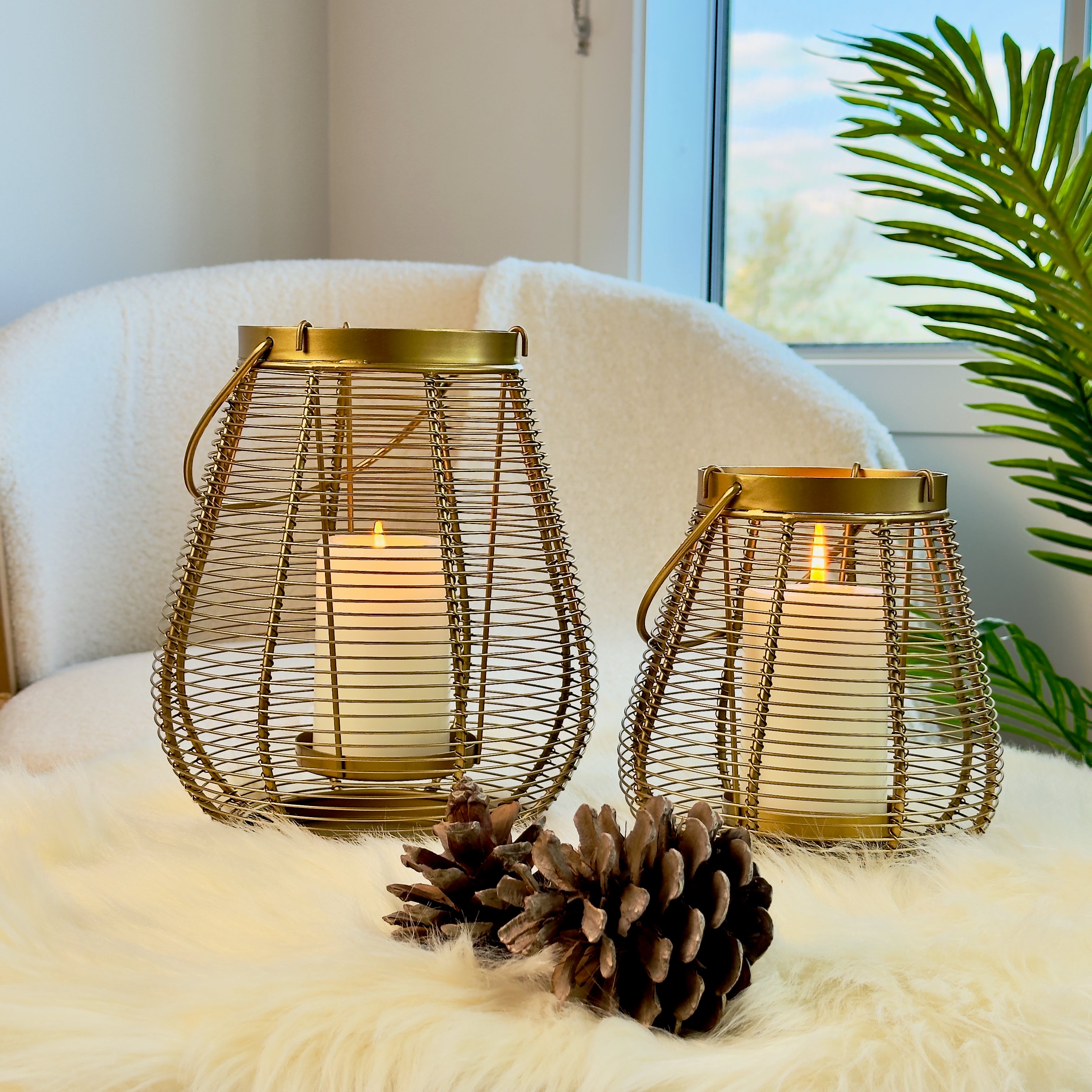 Product image of a Metal Cage Lantern from Indian Impressions, featuring a sleek, openwork cage design with a polished finish. This lantern is ideal for holding candles or LED lights, adding a warm and elegant ambiance to any space. Perfect for Vastu, home décor, or gifting.
