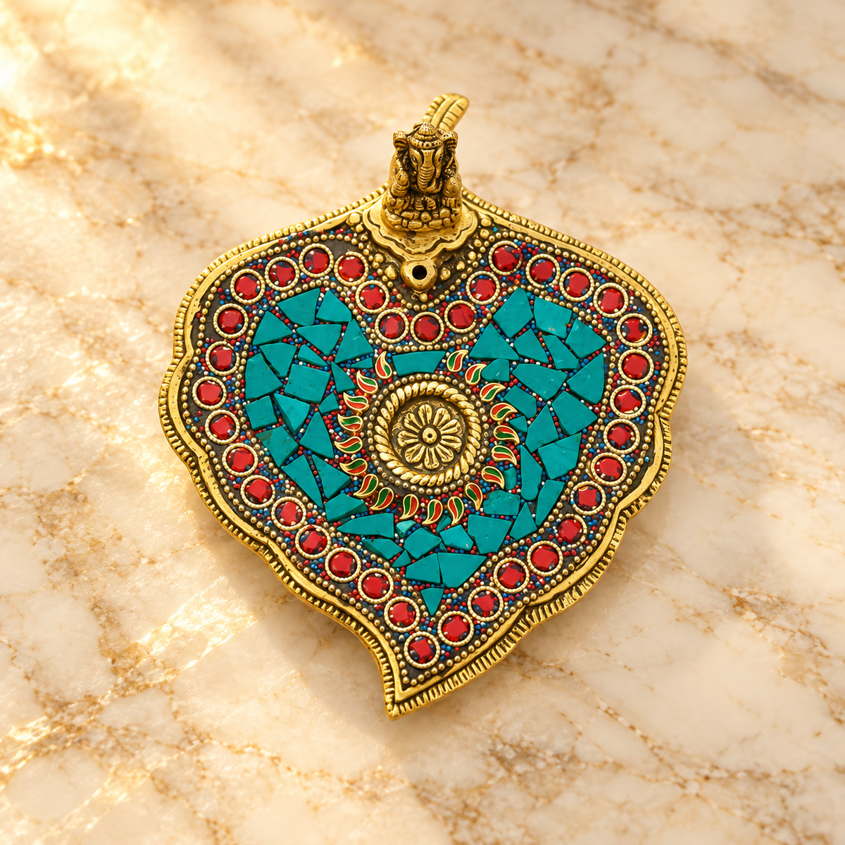Studded Ganesha paan leaf metal incense holder with turquoise and red detailing