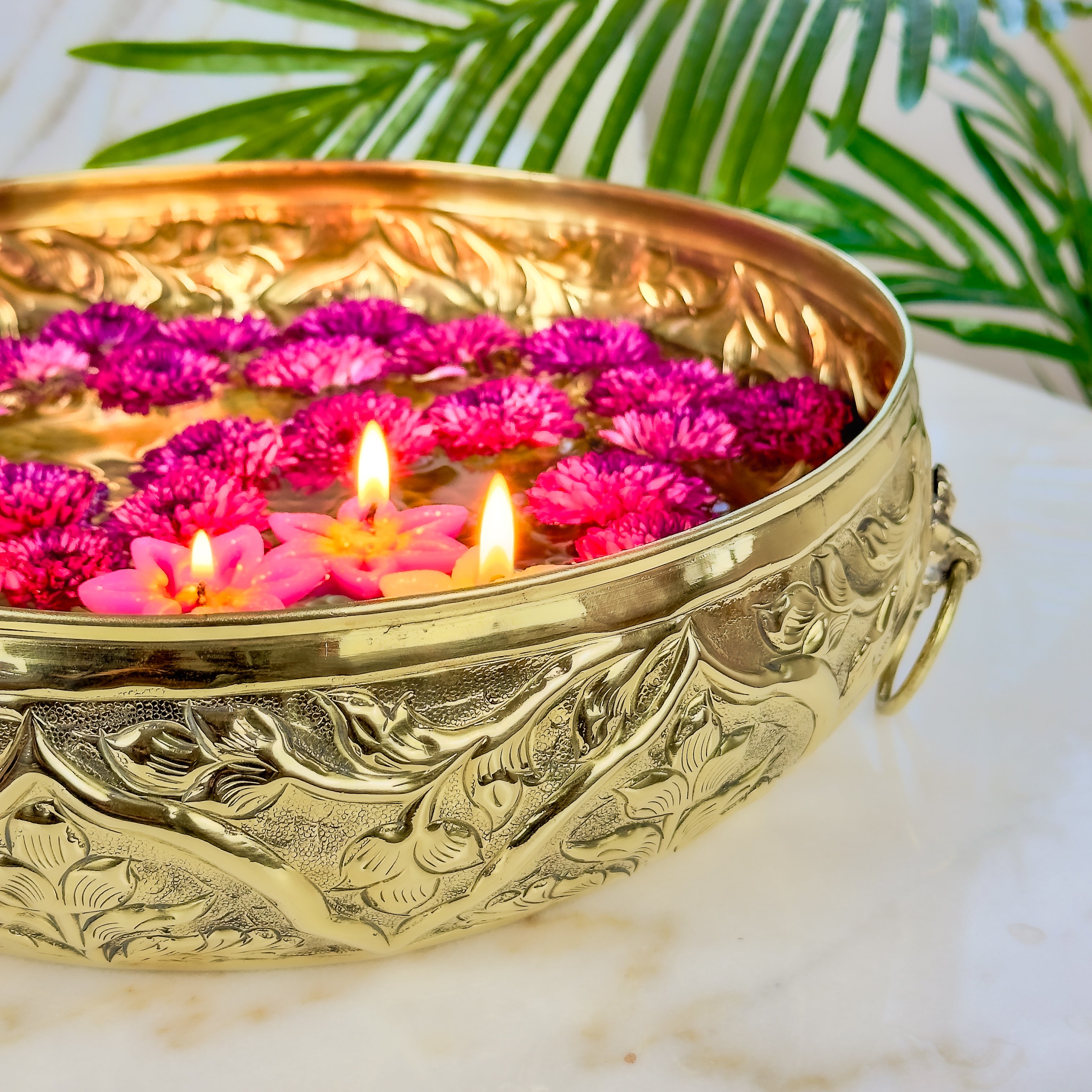 Product image of a Brass Gulmohar Urli from Indian Impressions, featuring a beautifully crafted design with intricate floral detailing. The urli has a polished brass finish, ideal for adding a touch of elegance to home décor, spiritual rituals, or gifting, and is perfect for enhancing the ambiance of any space.