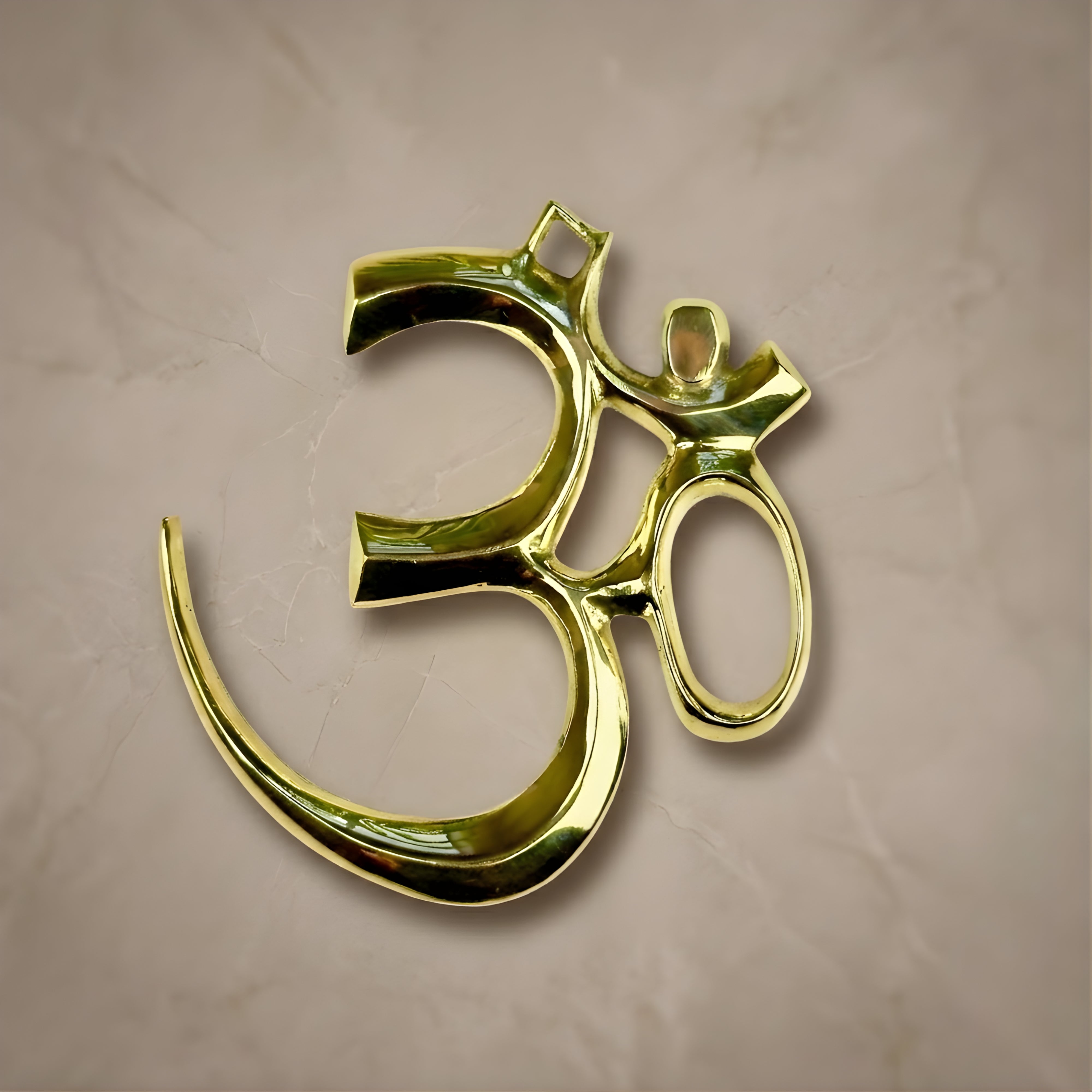 Handcrafted polished brass Om symbol wall-hanging, premium spiritual home decor by Indian Impressions.