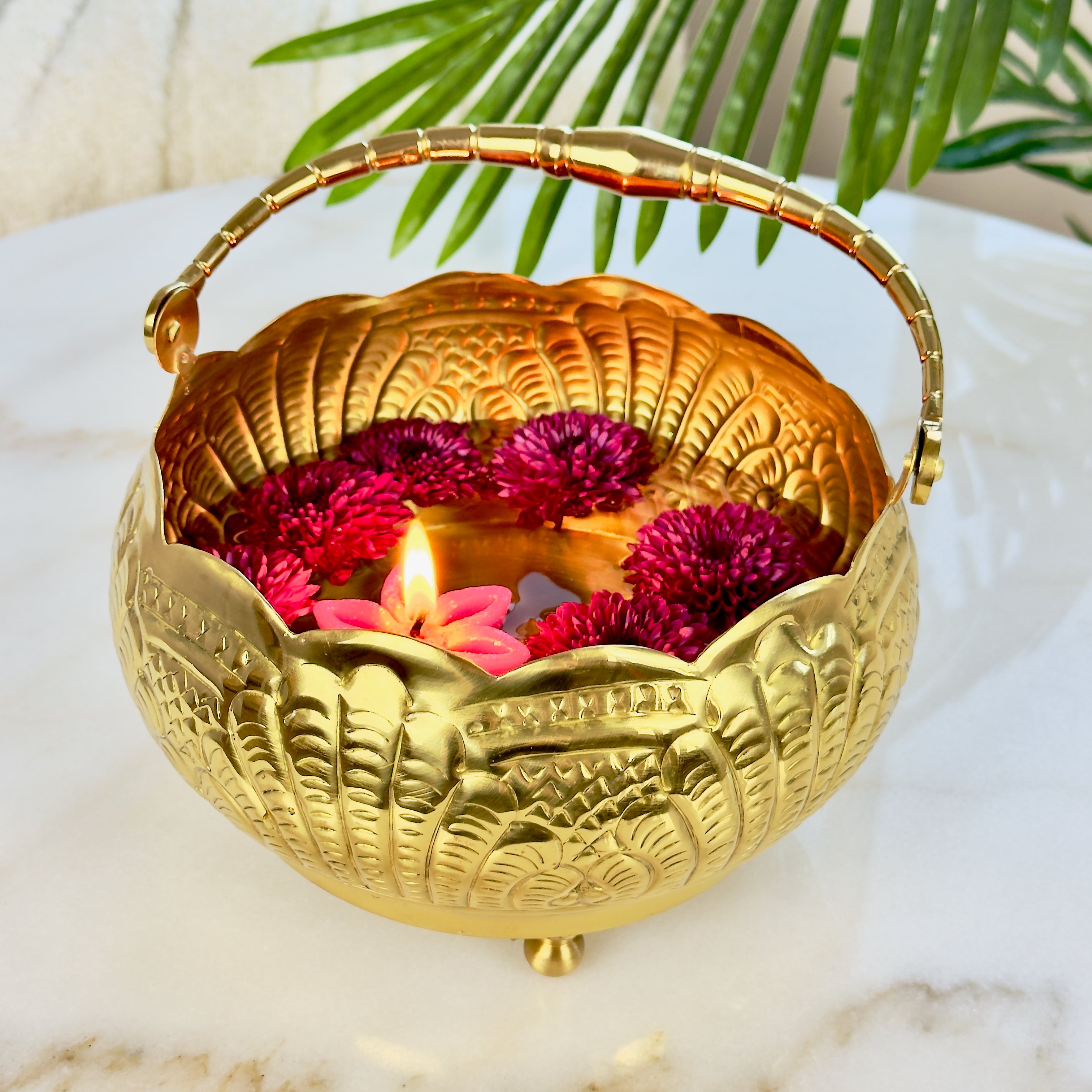 Product image of a Puspam Brass Flower Basket from Indian Impressions, featuring an intricately handcrafted design with traditional motifs. Made from polished brass, this elegant basket is perfect for holding flowers, enhancing Vastu energy, festive décor, or gifting, adding a touch of charm and positivity to any space.