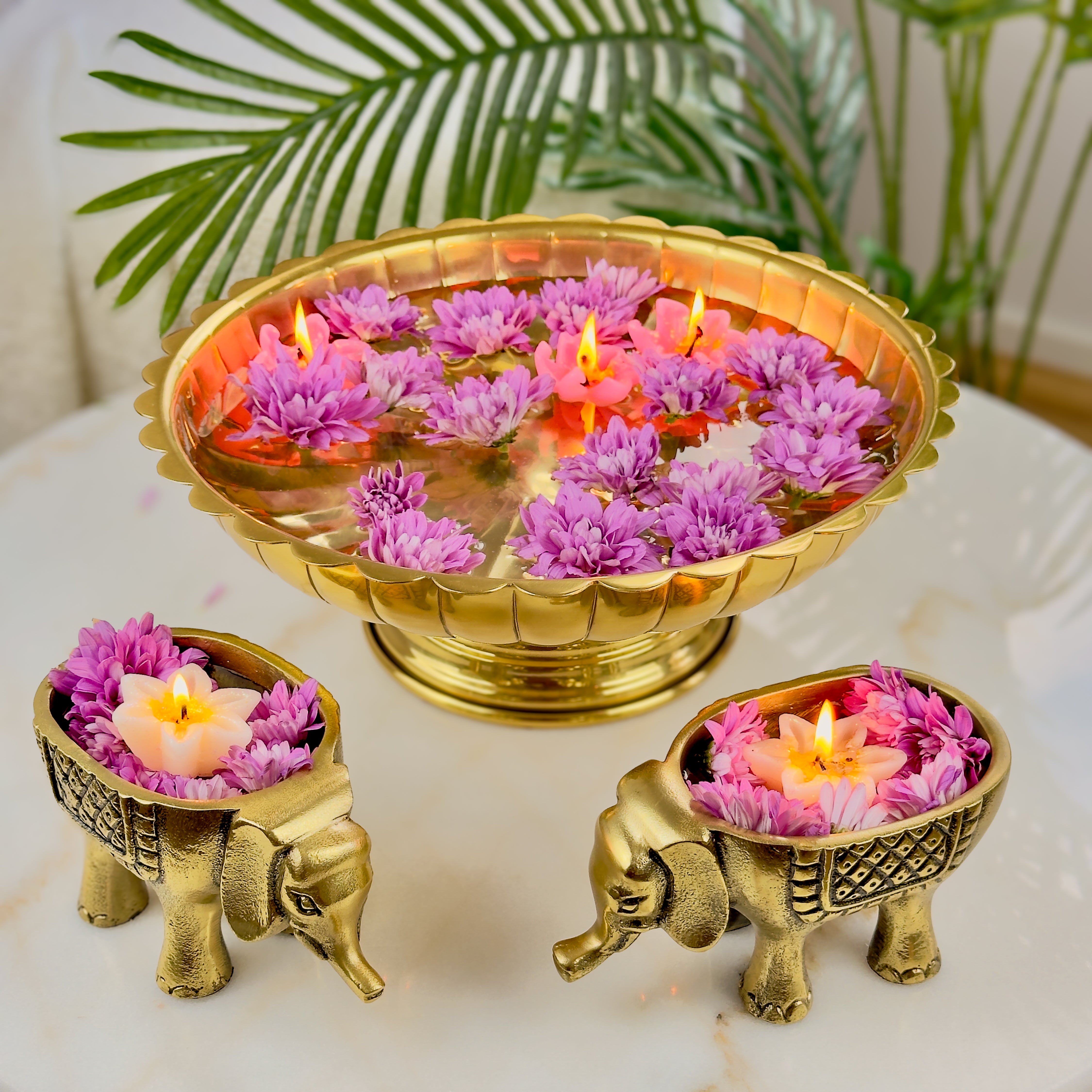 Product image of an Elephant Antique Brass Finish figurine from Indian Impressions, intricately crafted with detailed features. The elephant, symbolizing strength, wisdom, and good luck, is finished in a rich antique brass tone. The figurine comes with a gift box, making it an ideal gift for home décor, spiritual practices, or Vastu.