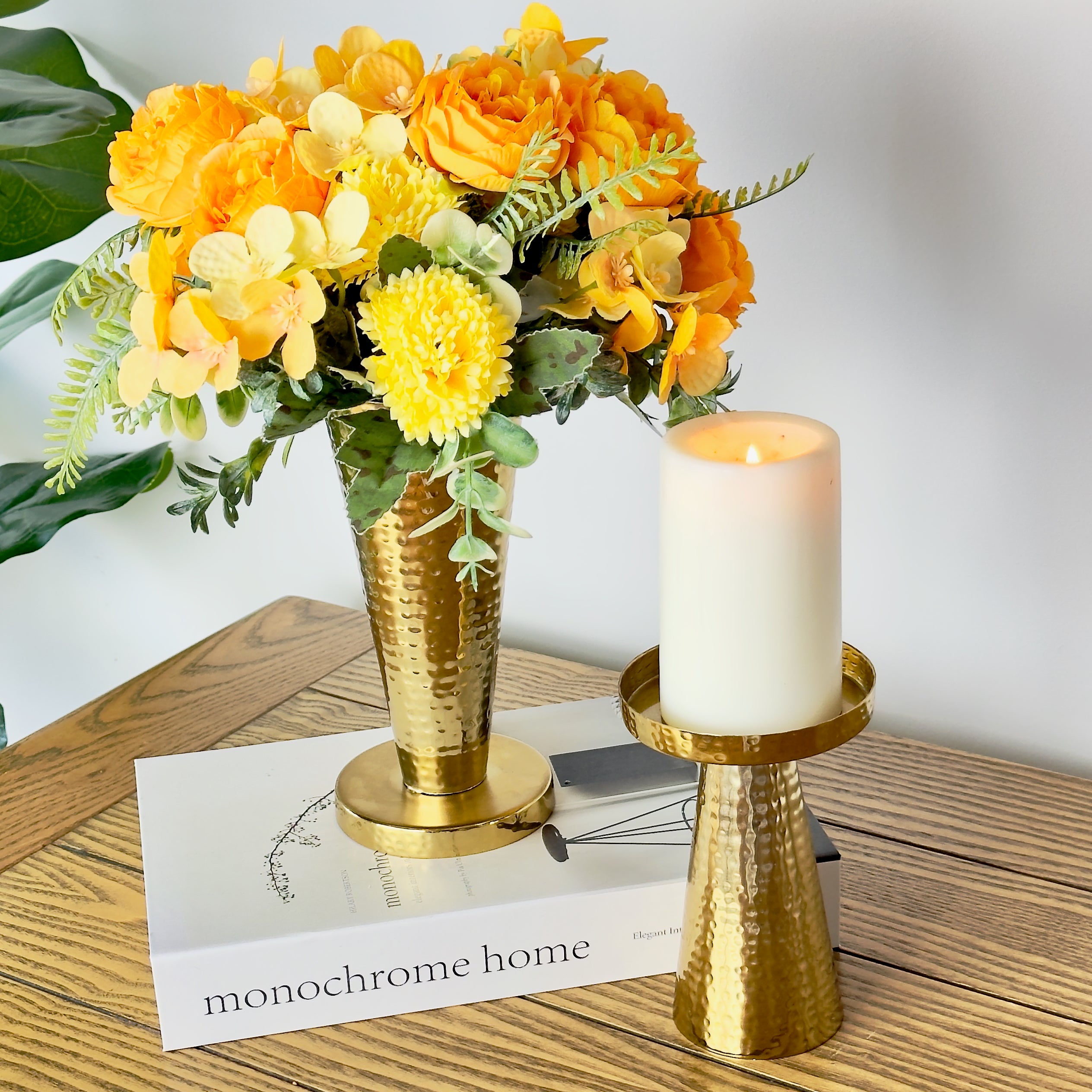 Product image of a Metal Candle Holder Set of 2 from Indian Impressions, featuring elegantly crafted holders with a hammered finish. Designed for pillar or taper candles, these holders add a touch of sophistication to any setting. Perfect for Vastu, home décor, festive occasions, or gifting.