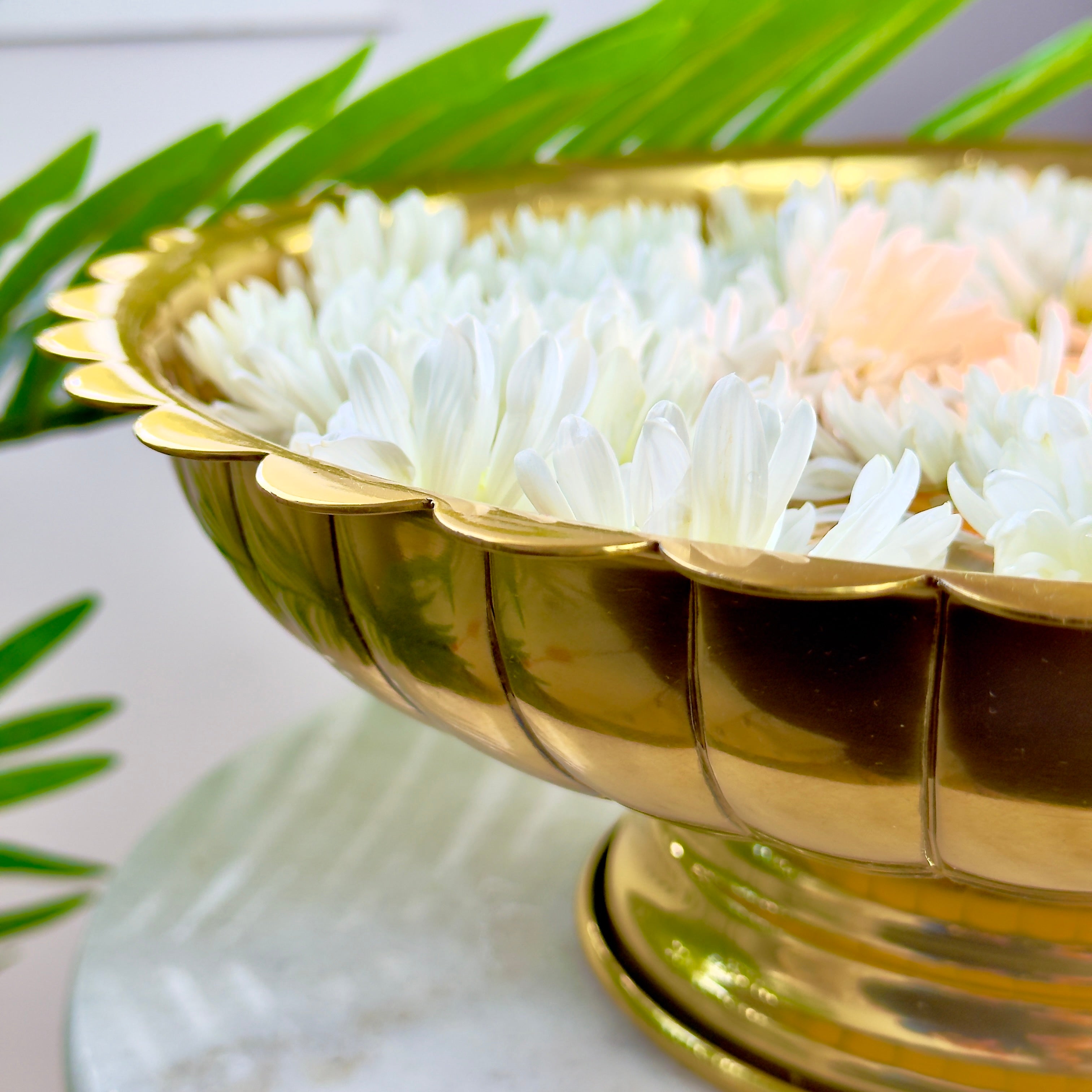 Product image of the Lotus Urli Gold from Indian Impressions, featuring a stunning lotus-inspired design with intricate detailing. Crafted with a polished gold finish, this urli is perfect for Vastu, home décor, festive decorations, or gifting, bringing elegance and positive energy to any space.