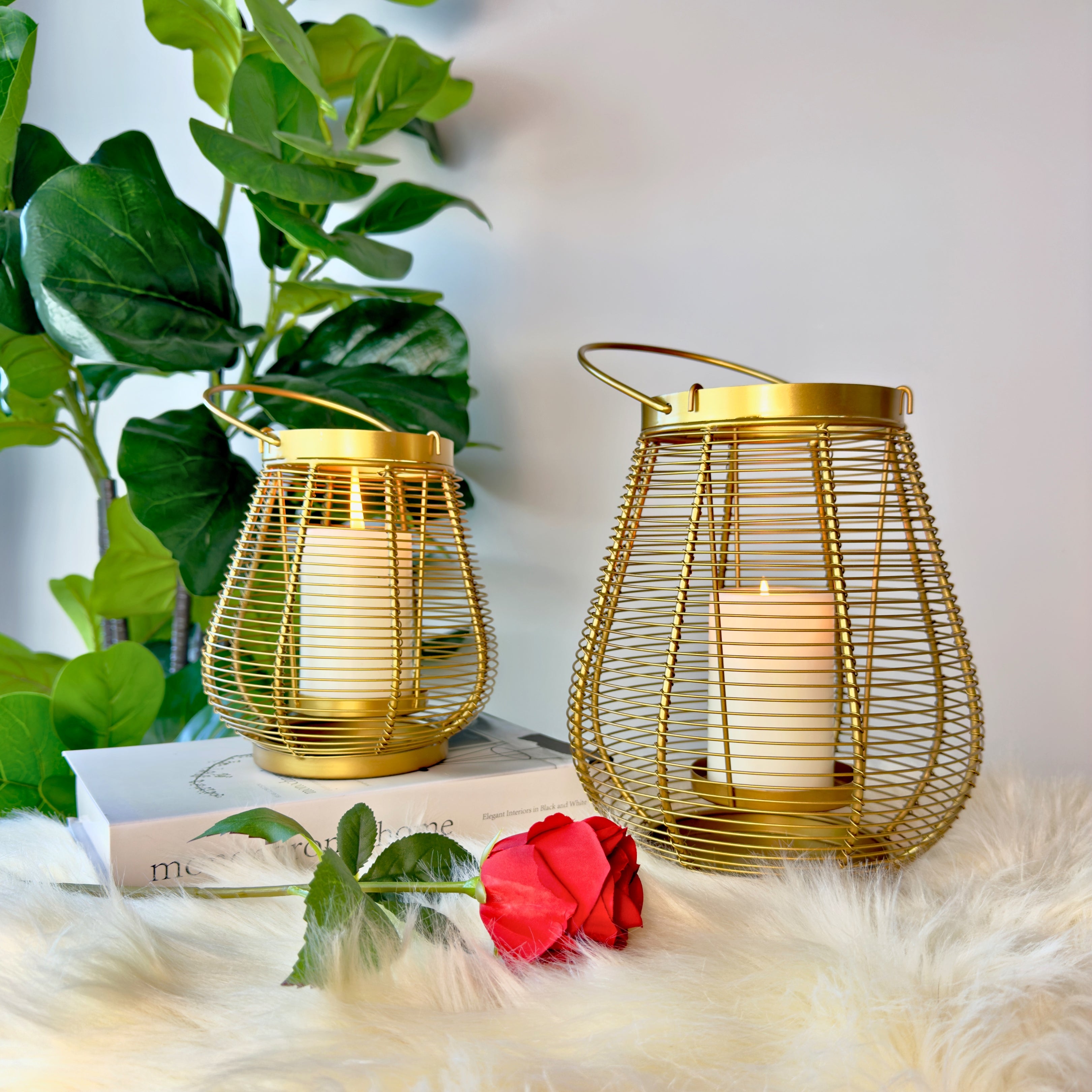Product image of a Metal Cage Lantern from Indian Impressions, featuring a sleek, openwork cage design with a polished finish. This lantern is ideal for holding candles or LED lights, adding a warm and elegant ambiance to any space. Perfect for Vastu, home décor, or gifting.