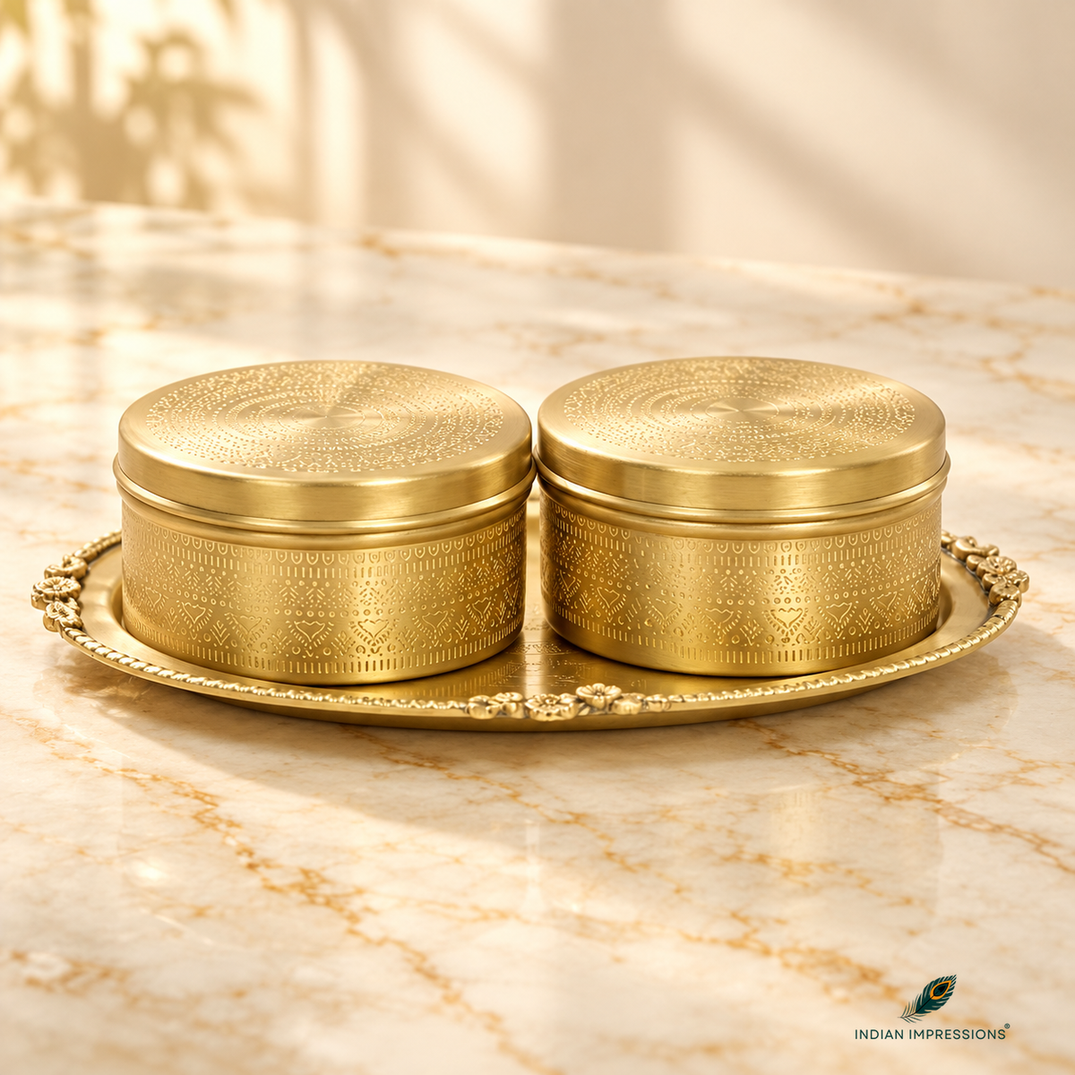 Pair of engraved brass sweet boxes with lids on ornate oval tray